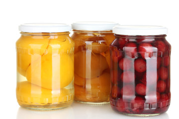 Fototapeta na wymiar Jars of canned fruits isolated on white