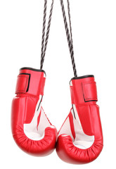 Red boxing gloves hanging isolated on white