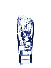 water splash in glass isolated on white