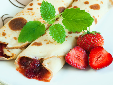Rolled pancakes with strawberries