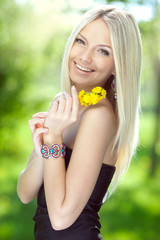 Portrait of a beautiful young woman with yellow flowers