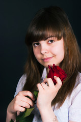 girl with a rose on a black background
