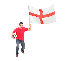 Full length portrait of an euphoric fan holding a ball and Engli
