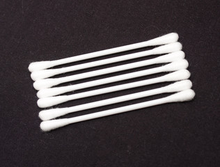 Cotton sticks isolated on black background