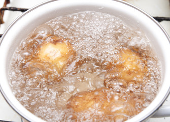New potatoes simmering in boiling water