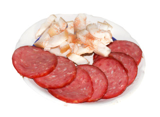 sausage and salty fat on the plate isolated on white background