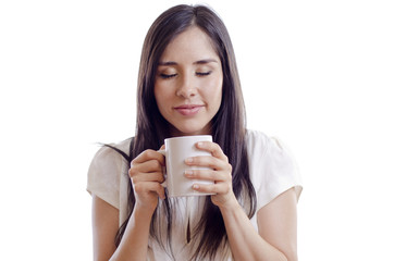 Cute girl enjoying a cup of coffee