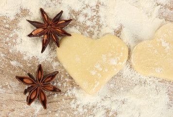 molded the dough with anise on wooden table close-up