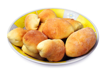Pies in round yellow plate