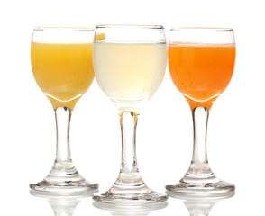 Tropical juices in glasses isolated on white