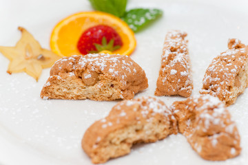 Delicious almond biscuits on a decorated plate.