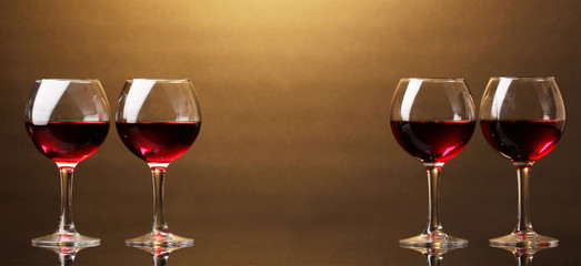 Wineglasses on brown background