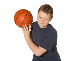 Teenager playing with a basketball