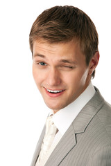 Closeup portrait of a young attractive man winking