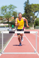 Fototapeta premium Male Track and Field Athlete during Obstacle Race