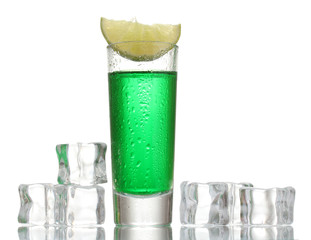 glass of absinthe, ice and lime isolated on white