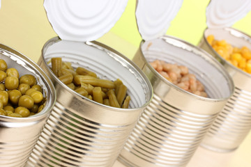 Open tin cans of peas, corn, bean and french bean