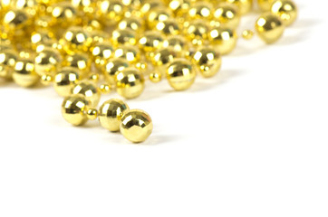 Background made of a brilliant celebratory beads of golden color