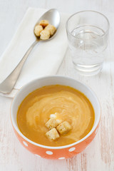 vegetable soup with sour cream on the bowl