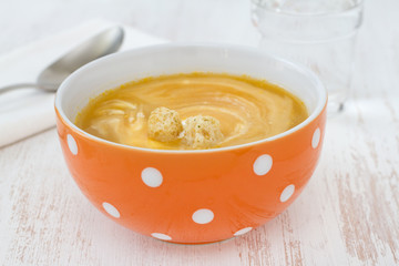 vegetable soup with sour cream on the bowl