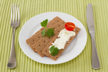 toasts with cream cheese and tomato