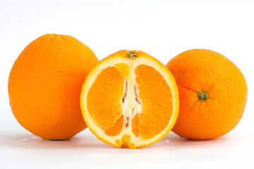 Sliced orange fruit segments isolated on white background