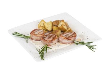Grilled steak wrapped in bacon, with grilled vegetables, mashed