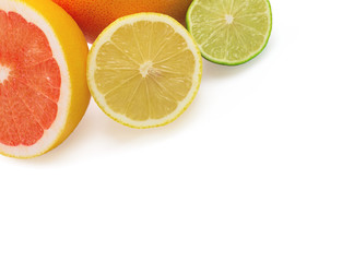 Image of a fresh whole lime, lemon and orange isolated on white