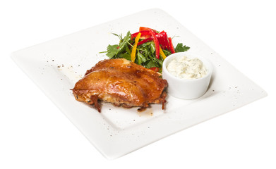 roasted chicken with vegetables on a white plate