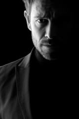 Low key portrait of mid age man