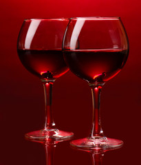Wineglasses on red background