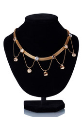 beautiful golden necklace on mannequin isolated on white