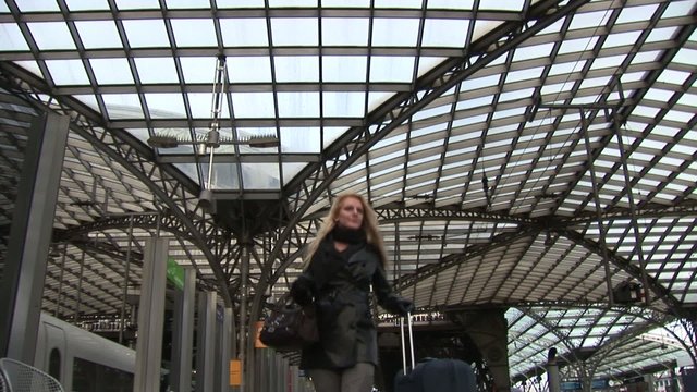 Business woman on the phone on central station