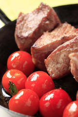 Pork kebab and tomatoes