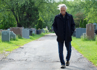 Man walking in cemetery