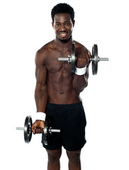 Fototapeta na wymiar Muscular man doing exercise