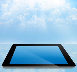 cloud computing concept tablet pc with cloudy sky