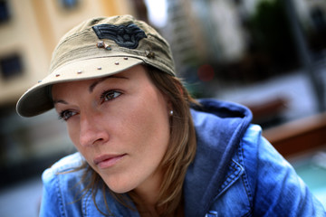 Streetwear woman sitting in the street