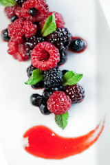 Wild berries with fruits of the forest sauce