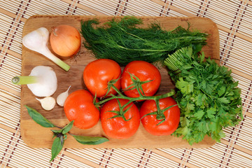 fresh tomatoes on a branch