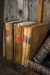 Fototapeta na wymiar Antique books on a book shelf