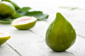 Green Fioroni Figs on White Wood