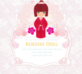 Kokeshi doll on the pink background with floral ornament