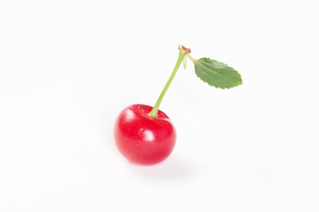 cherry with green leaf on white background
