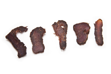 Biltong-(beef jerky) isolated on a white studio background.