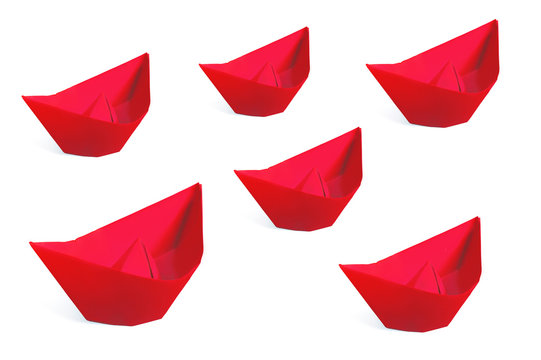 Red paper ships isolated on a white background