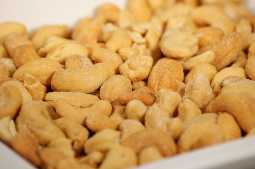 Delicious cashew nuts isolated on a white plate
