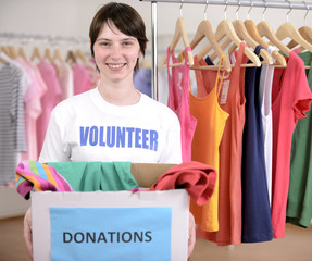 Volunteer with clothing donation