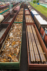 containers and cars at the railroad station