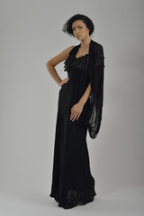 Fototapeta premium elegant woman in fashionable dress posing in the studio